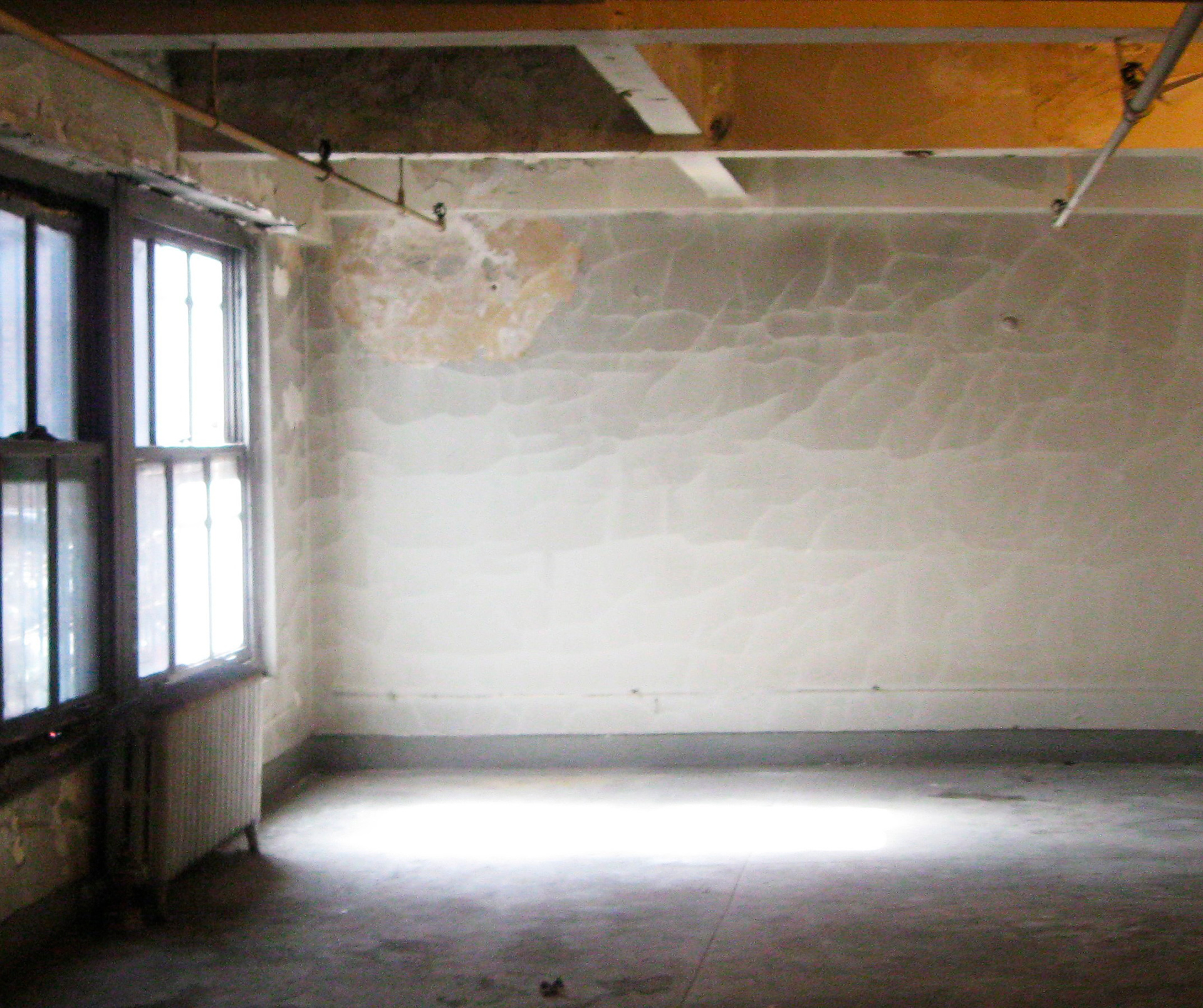 Existing conditions of a typical floor at 114 East 25th Street prior to building renovation